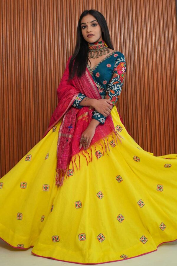 Jagruti Website 02-06 (1) Turquoise V-Neck Blouse with Yellow Patchwork Skirt