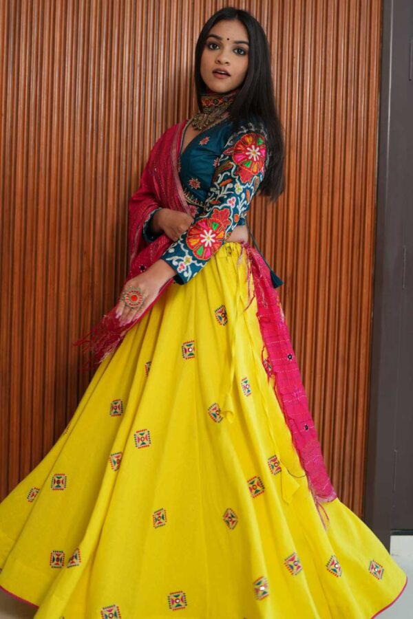 Jagruti Website 02-09 (1) Turquoise V-Neck Blouse with Yellow Patchwork Skirt